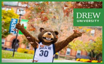 mascot in jersey at campus with 'drew university'