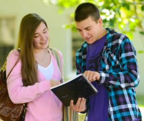 two students looking at a tablet