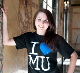 student smiling in 'i heart mu' t-shirt