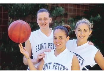 basketball players posing with ball