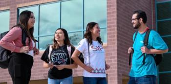 students talking in front of 'SIPI' building