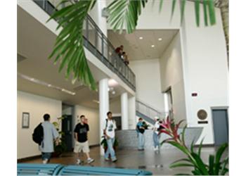 spacious atrium with students and plants