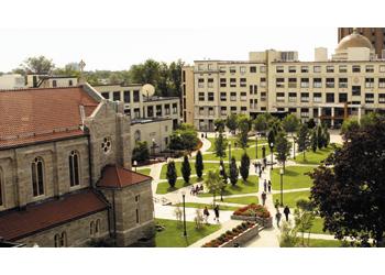 aerial view of campus with buildings and green space