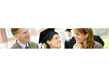 graduating student smiling with two adults