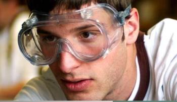 person wearing safety goggles looking focused