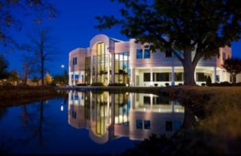 building with reflective glass facade at twilight