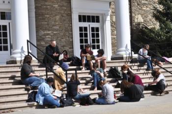 students gathering on steps for an outdoor class