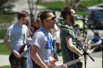 band performing outdoors in sunny weather