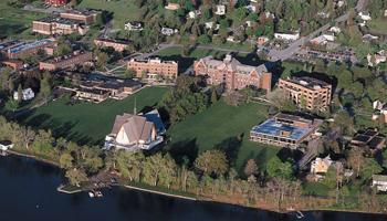 aerial view of campus buildings and green fields