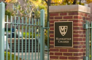 manhattan college entrance gate with emblem