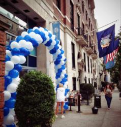 blue &amp; white balloon arch at entrance