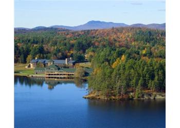 aerial view of lakeside campus with autumn foliage