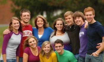 group of college students smiling outdoors