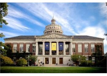 historical building with a dome and 'University of Rochester' banner