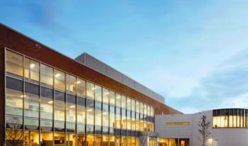 modern building with glass facade at dusk