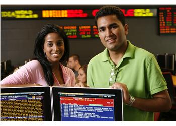 students at trading screens in financial lab