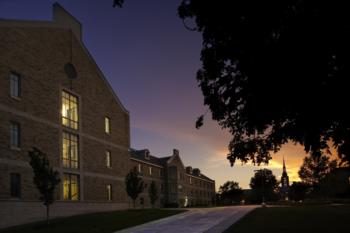campus building at dusk with glowing windows