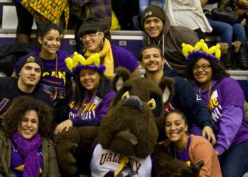 group with mascot in purple gear