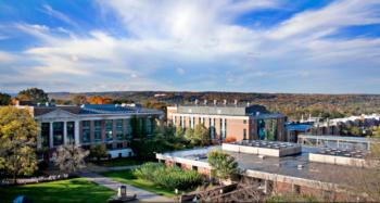 campus with trees and brick buildings