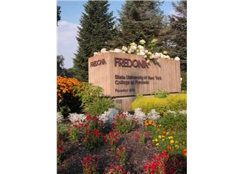 wooden sign with 'Fredonia State University of New York College of Arts'