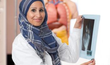 medical student holding an x-ray