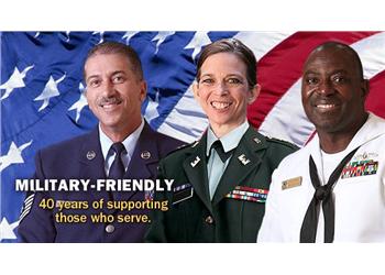 military personnel in front of american flag with text