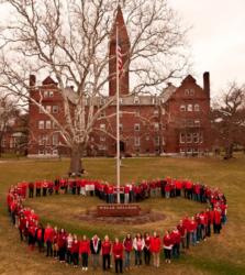 heart-shaped gathering of people on campus