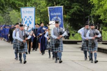 bagpipers leading a graduation procession