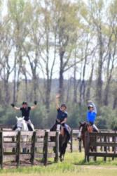 riders on horseback celebrating outdoors