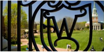 decorative iron gate with university initial & campus view