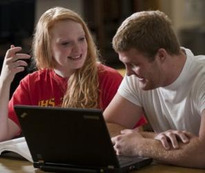 two students studying with a laptop