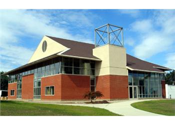 contemporary campus building with red brick and geometric design