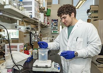 student conducting an experiment in a science lab