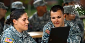 two soldiers with a laptop under 'Cameron University'