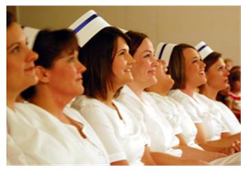 line of nurses in uniform sitting side by side