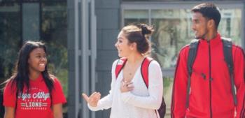 students walking and chatting on campus