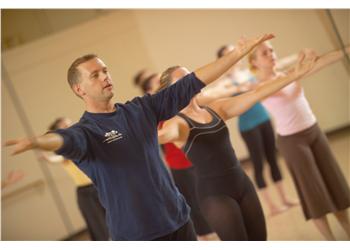 instructor leading dance class