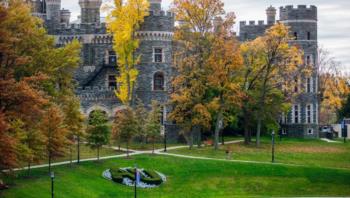 castle-like building with autumn trees