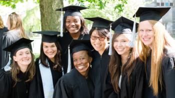 group of graduates smiling together