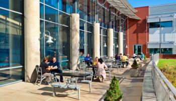 students in outdoor seating area