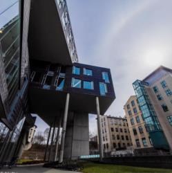futuristic campus building with stilts