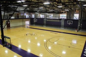 empty basketball gym with bleachers