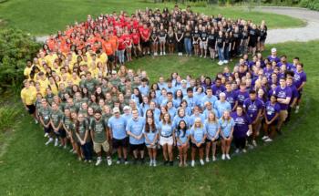 large group of students forming a heart