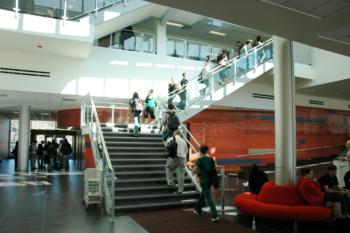 busy staircase in modern campus building