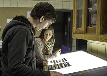 two students working at a light table