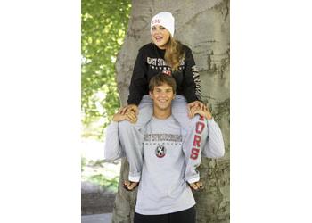 students with campus gear on tree