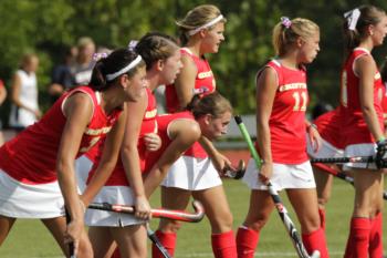 field hockey team lined up on the field