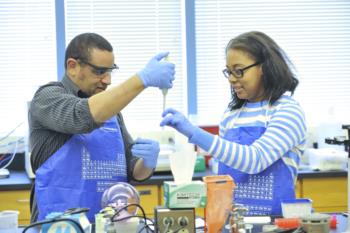 two people conducting an experiment in lab