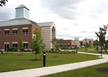 brick campus building with a clear sky