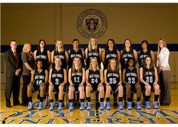 basketball team in uniform with coaches